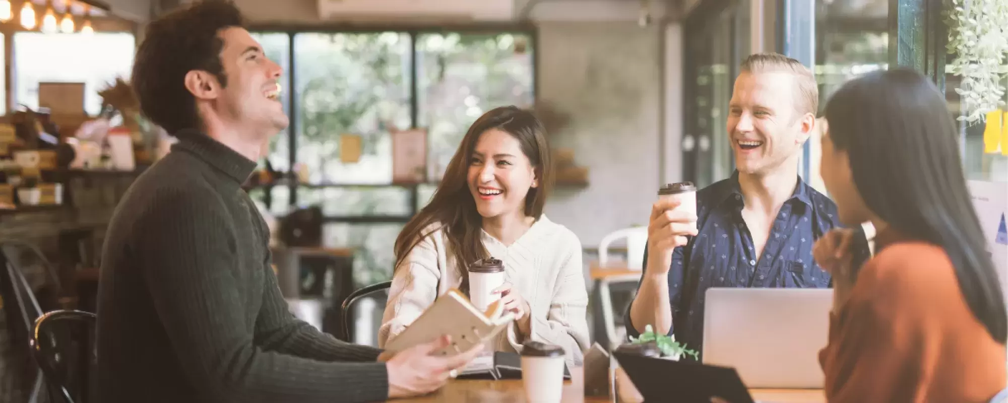 Group of three people laughing