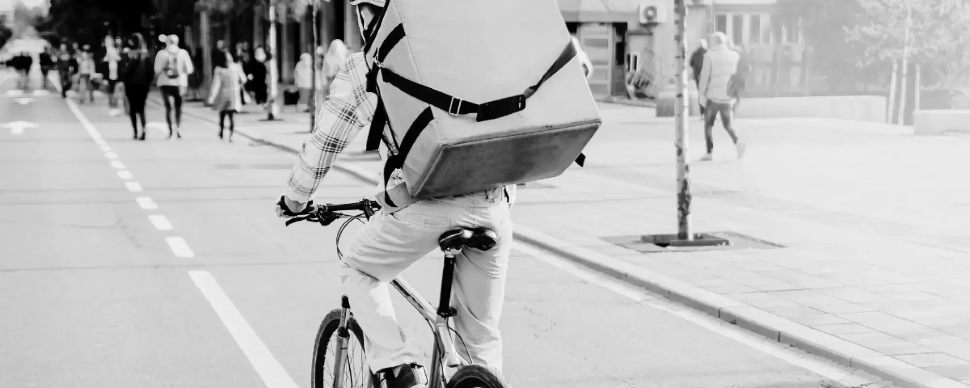man making a delivery on a bicycle