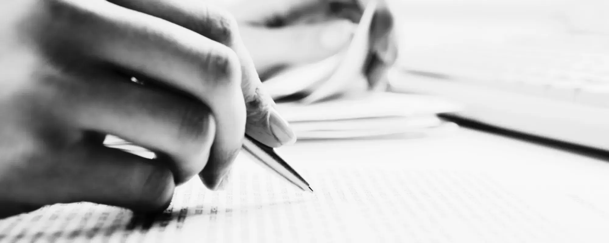 Someone filling in a document