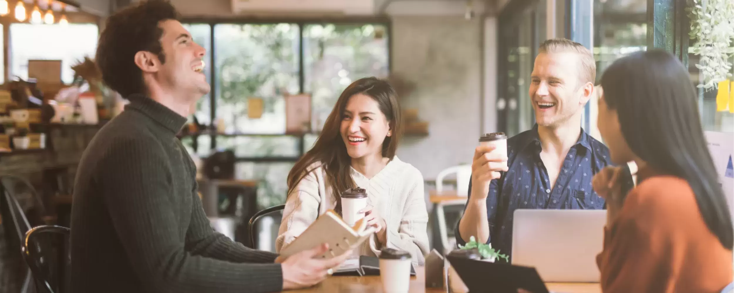 Group of three people laughing